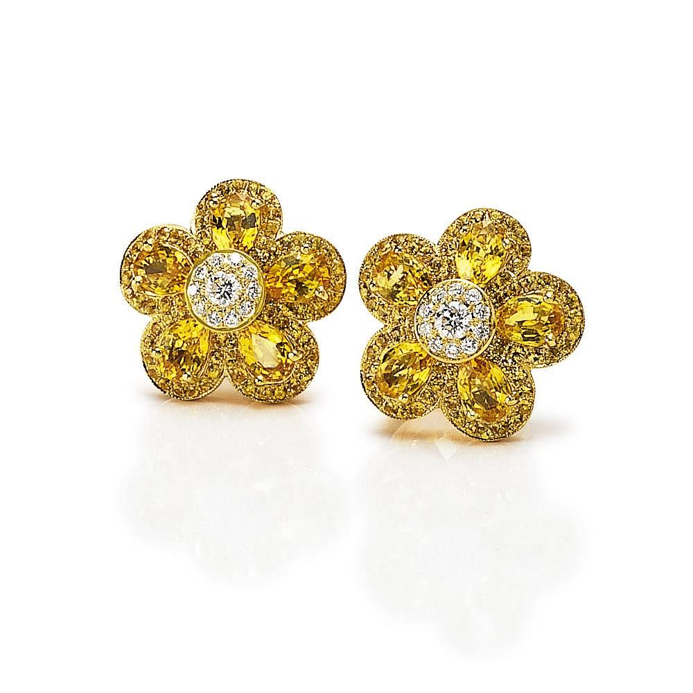 Cellini's  iconic Flower Power earrings . These stunning earrings are composed with five pear shaped  yellow sapphires  ,with a round brilliant diamond center. Each petal and center are surrounded with micro pave. The Flower measures approximately