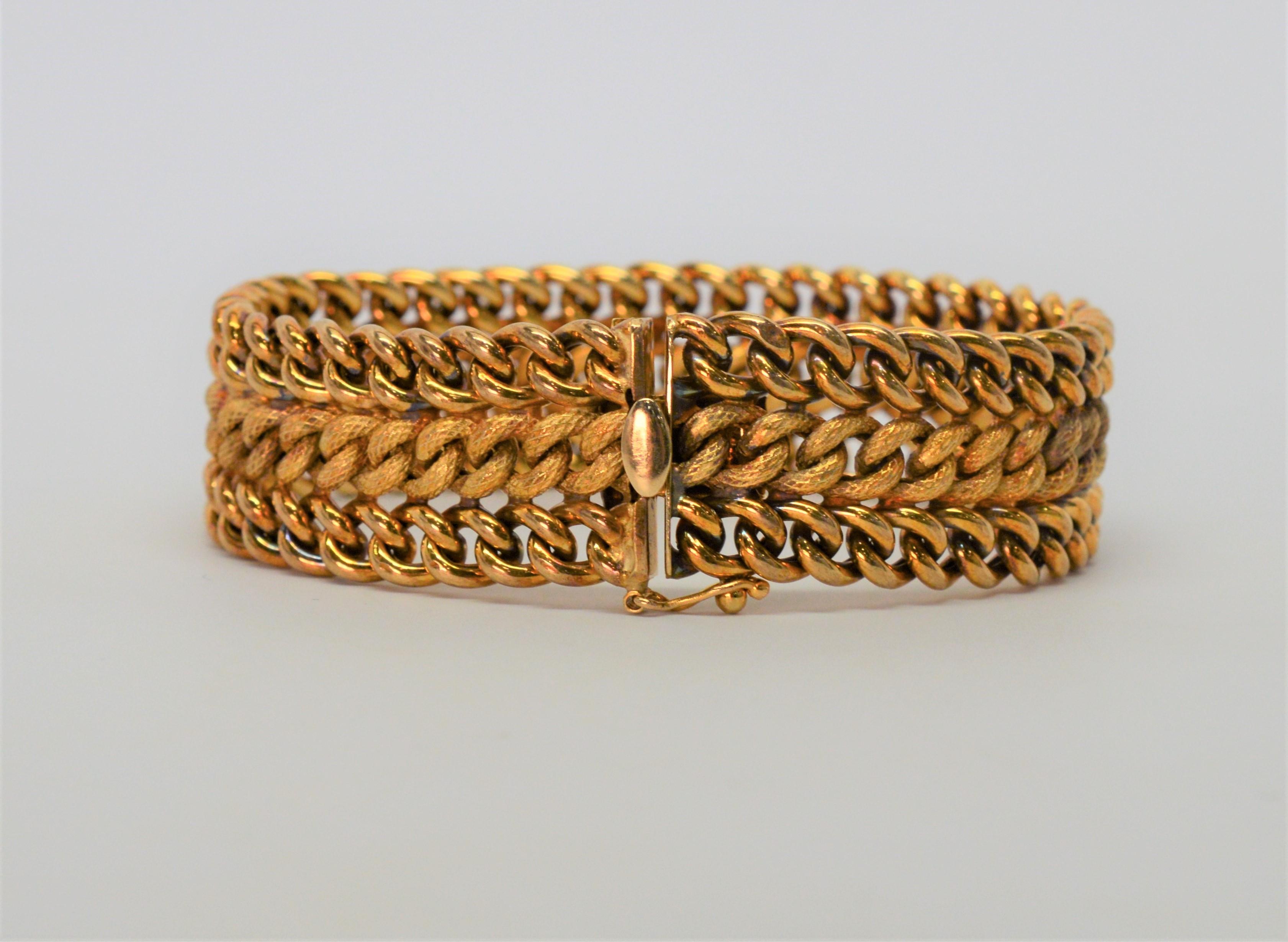 Quality 1950's style fourteen karat (14K) Yellow Italian Gold Woven Bracelet. The 3/4 inch band displays a two-tone look with alternating chain layers of polished and satin 14 karat yellow gold links with considerable heft. Comfortable, soft and