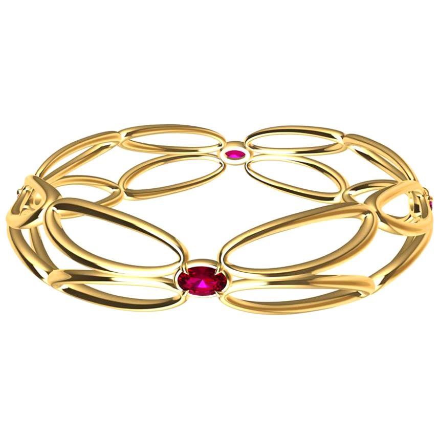 Bracelet à ailes arabesques en or jaune 18 carats et rubis