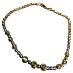 Bracciale a sfera bicolore in oro giallo e bianco 18 carati da 5,8 grammi, lungo 7 pollici