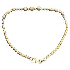 Bracciale a sfera bicolore in oro giallo e bianco 18 carati da 5,8 grammi, lungo 7 pollici
