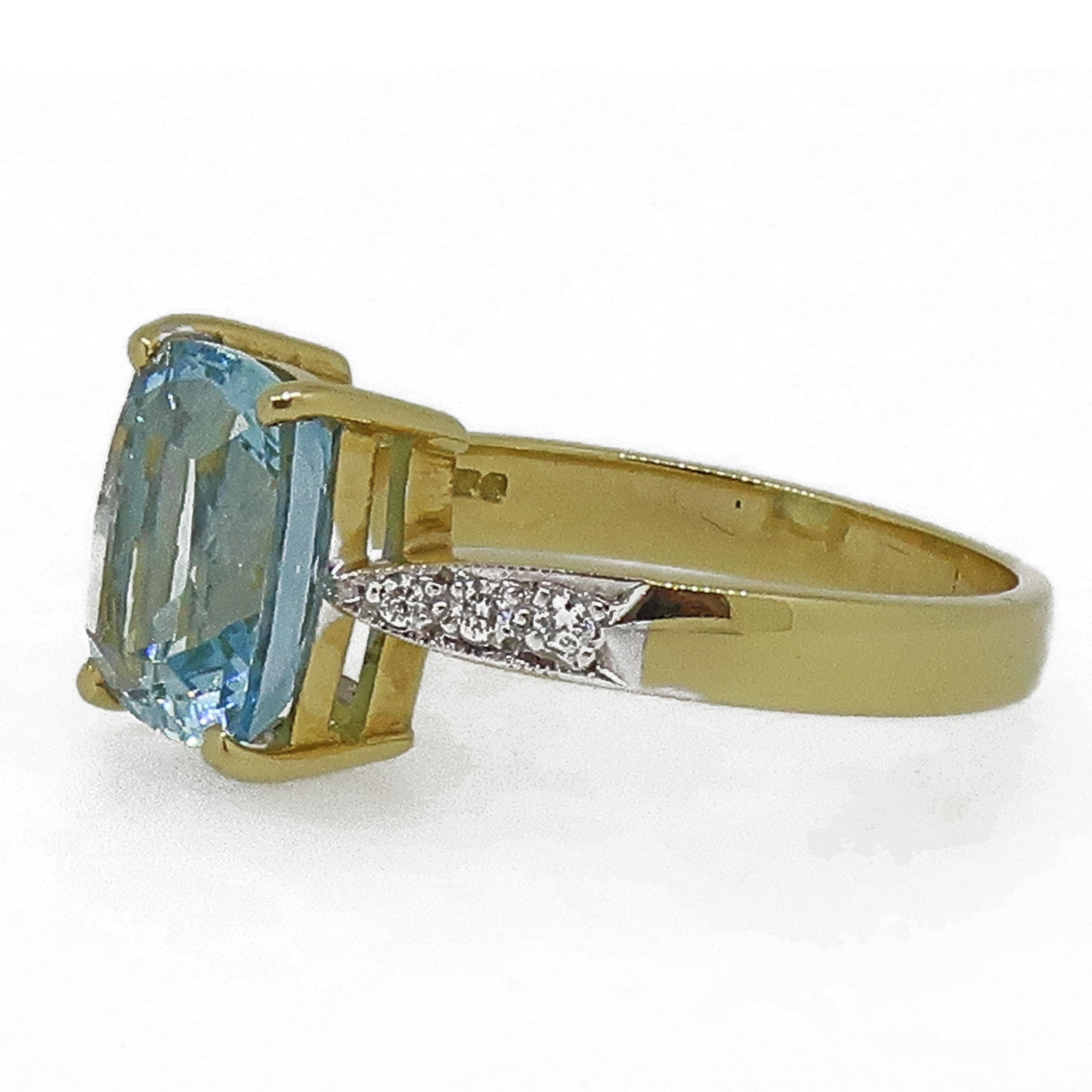 18ct Yellow & White Gold Cushion Cut Aquamarine Solitaire Ring

A dazzling Aquamarine Solitaire. The cushion cut aquamarine is a lovely bright blue colour, set in four yellow gold claws on a double gallery setting. The shoulders have small white