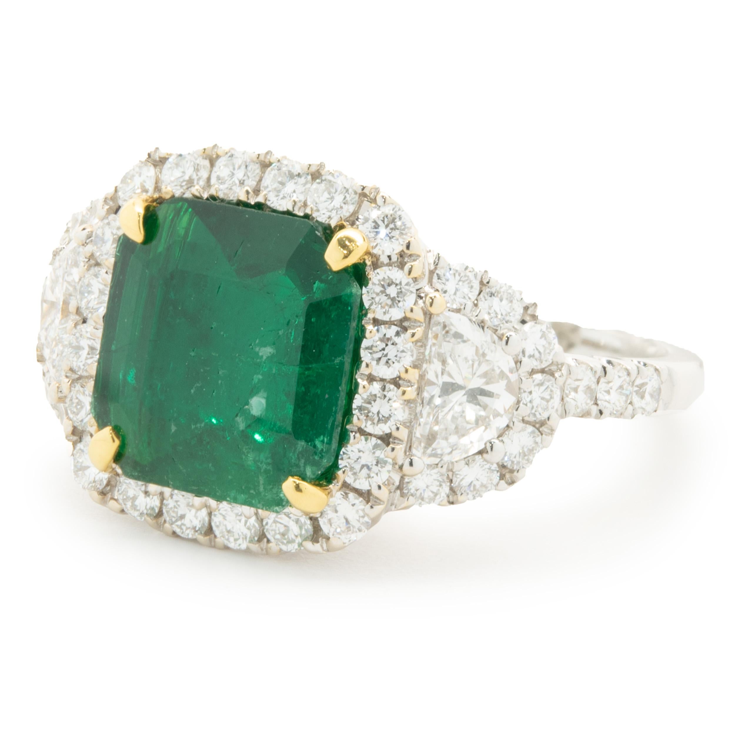 Designer: custom design
Material: 18K yellow & white gold
Emerald: 1 cushion cut = 3.47cttw
Diamond: 2 half moon cut = 0.49cttw
Color: G
Clarity: VS2
Diamond: 42 round brilliant cut = 0.80ct
Color: G
Clarity: VS2
Dimensions: ring top measures 13mm