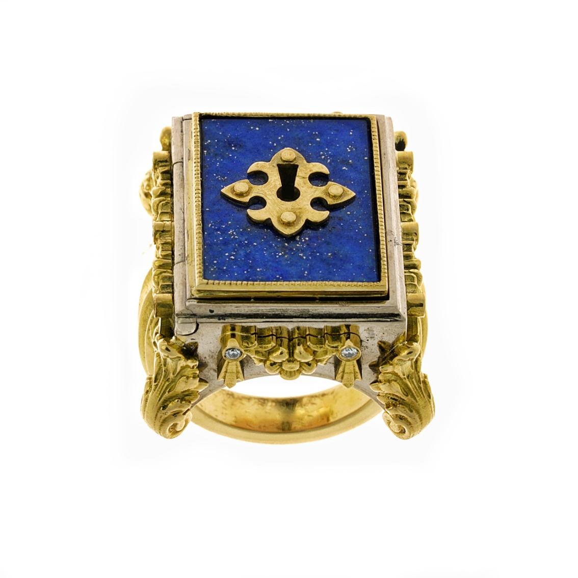 The epitome of luxury, the Celestial Chamber Ring oozes nobility and power.

Handcrafted in 18kt yellow and white gold, this regal ring features a vivid 21mm x 16mm lapis lazuli inlaid lockable chamber, studded with 10 white diamond accents and