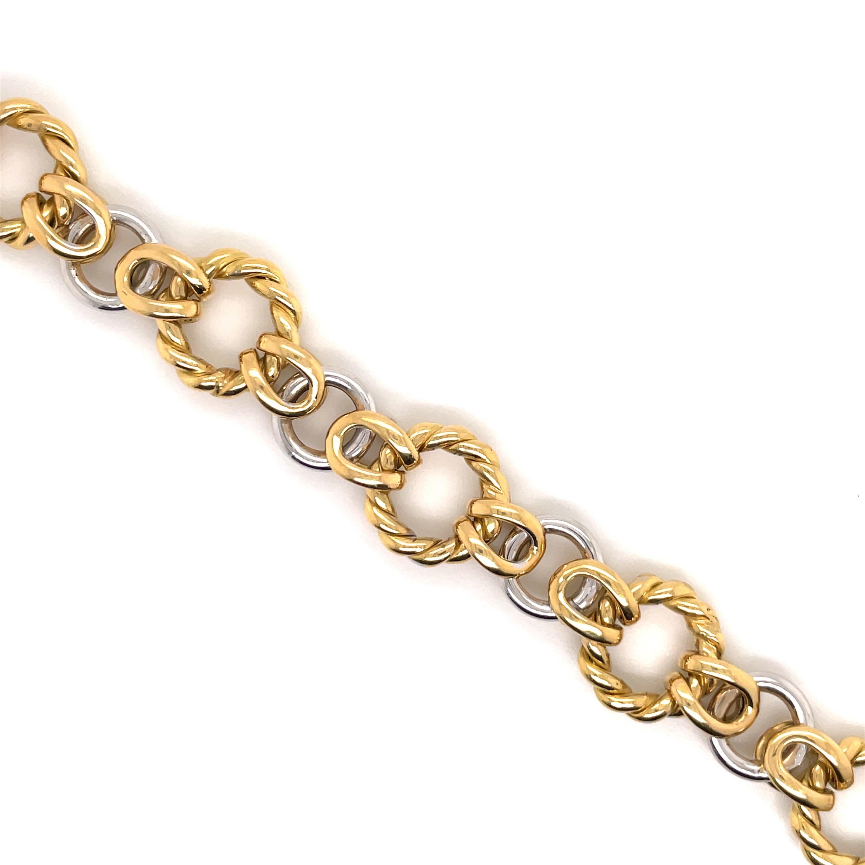 18 Karat yellow & white gold bracelet featuring 13 round links weighing 20.8 grams. Made In Italy. 
Great for stacking!
More Link Bracelets Available.