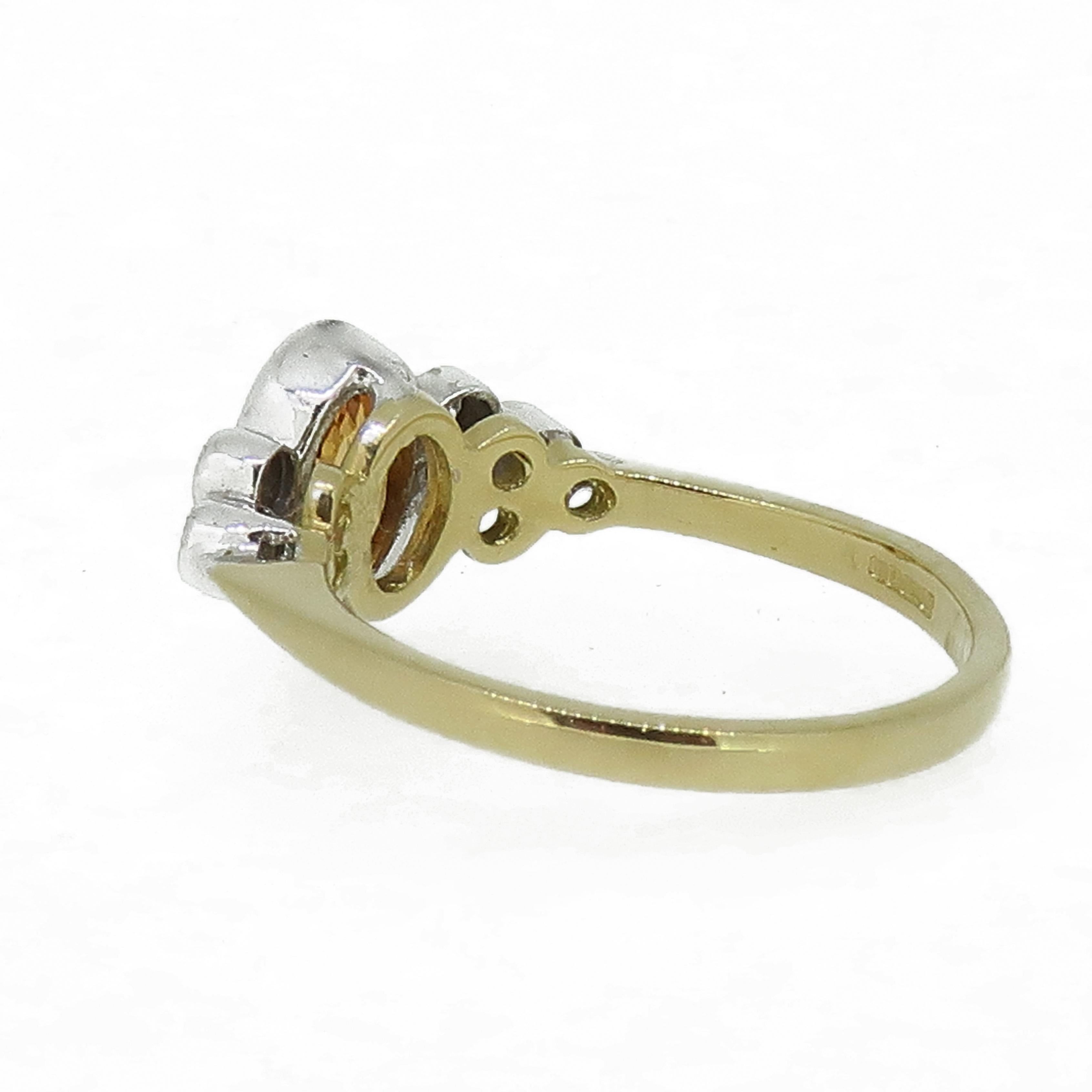 18 Karat Yellow & White Gold Oval Yellow Sapphire and Diamond Ring

A dazzling and dainty yellow sapphire and diamond ring. The central oval yellow sapphire is a lovely bright colour encased in a 18ct white gold rub over setting, with a trefoil of