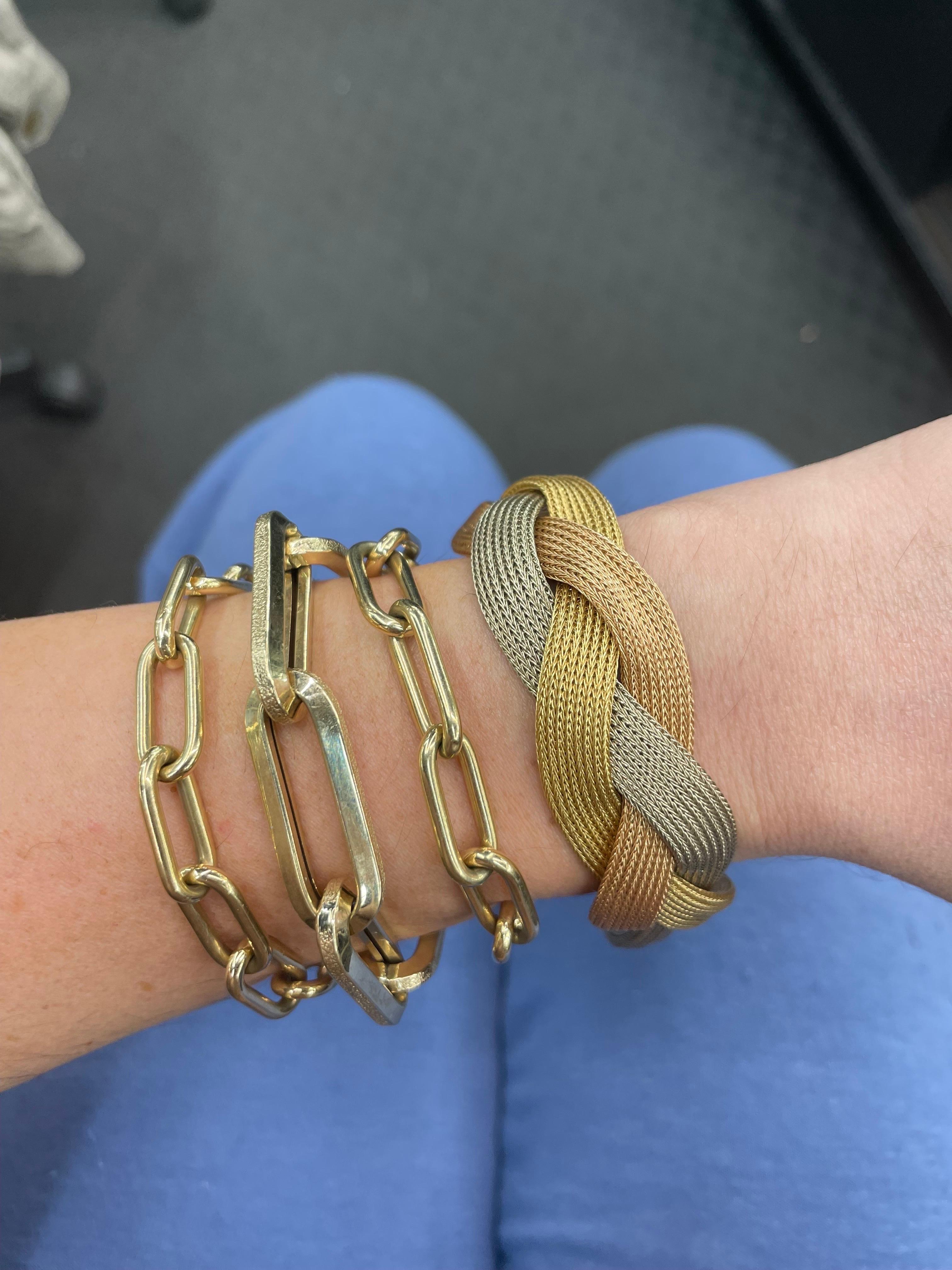 18 Karat Yellow, White & Rose Gold bracelet featuring a braided woven design weighing 45.5 Grams. 
Very comfortable on the wrist! 
Available in yellow gold. 