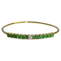 Bracciale in oro giallo 18 carati con diamanti e tsavorite