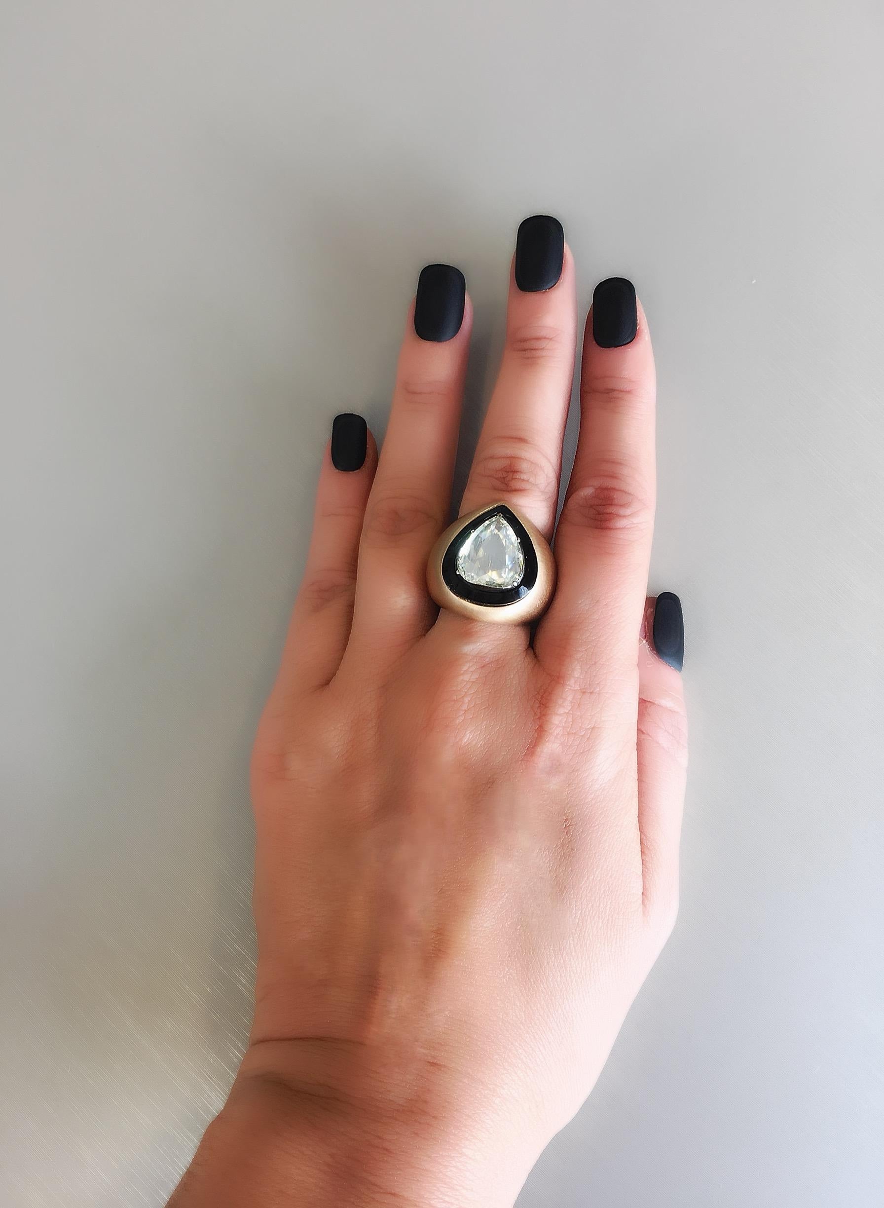 18 Karat brushed yellow gold 'Sultan Ring' from the Queen of Gems Collection created by Monan with a central 4.12 carat pear-shaped rose cut diamond surrounded by onyx. 
Finger size: 54 (Europe)= 7 (US)= N 1/2 (UK)  This ring can be re-sized* Please