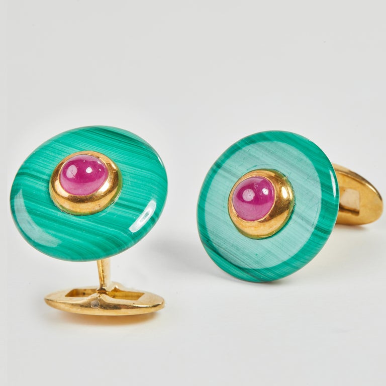 
18 Karat Yelow Gold Ruby and Malachite Cufflinks
2 Malachite 19.70 Carat
2 Ruby cab. 2.72 Carat

Founded in 1974, Gianni Lazzaro is a family-owned jewelery company based out of Düsseldorf, Germany.
Although rooted in Germany, Gianni Lazzaro's style