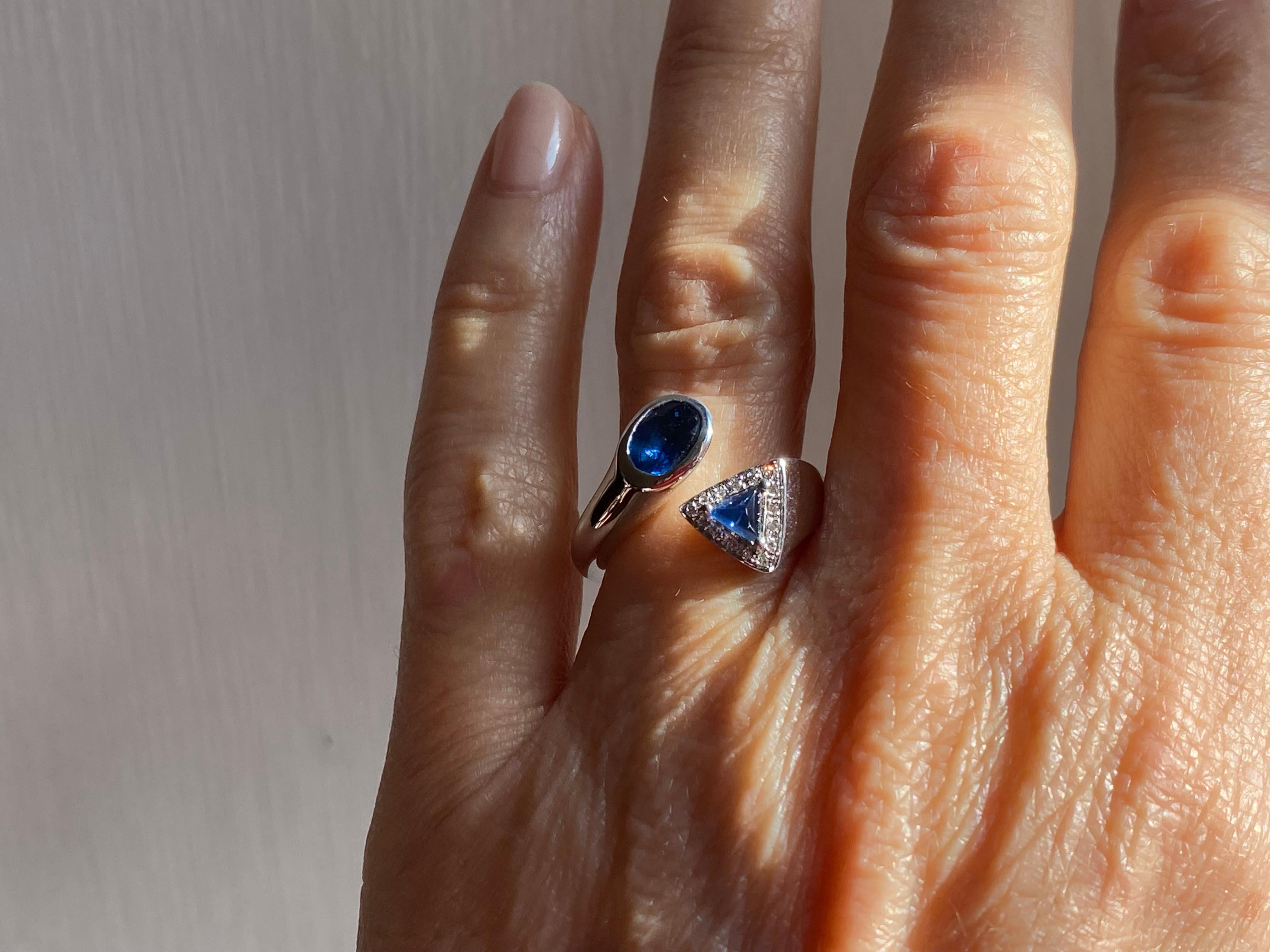Rossella Ugolini Design Collection Unisex and ready to ship a 18 Karats White Gold 1.20 Karats Sapphire 0.075 White Diamonds Toi et Moi Contraire Design Ring.
The Toi et Moi style is a Timeless ring made with two separate stones the look at each