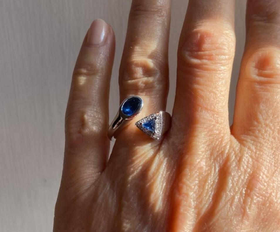 Rossella Ugolini Design Collection a beautiful Sapphire To et Moi Unisex Design ring handcrafted in 18 karats White Gold and embellished with 0.075 brilliant-cut White Diamonds  and a deep blue 1.20 Karats Sapphire.
Available size  6 USA , other