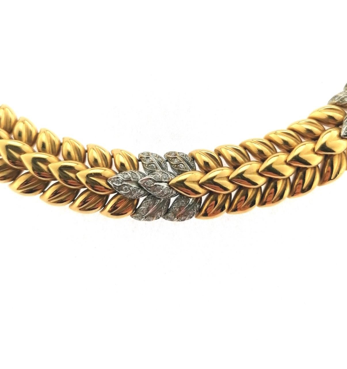 Wonderful 18 Karats White and Yellow Gold Choker with Brilliant Cut Diamonds with leaves shape. It is a consistent choker very well done that gives a touch of elegance because It is very tight around the neck. It has a lenght of 45 centimeters.