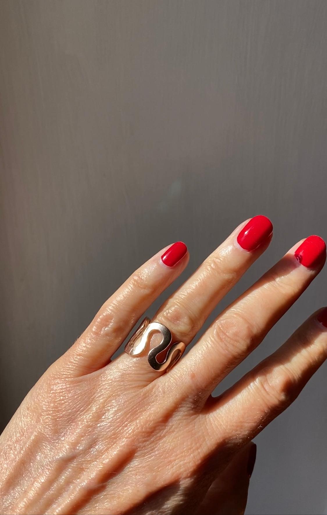 Rossella Ugolini Design Collection 18k Yellow Gold Unisex Wave Modern Design Band Ring. 
All size are available in two weeks on order. 
This ring is inspired by the continuous unfolding of the waves. The wave design continues across the entire