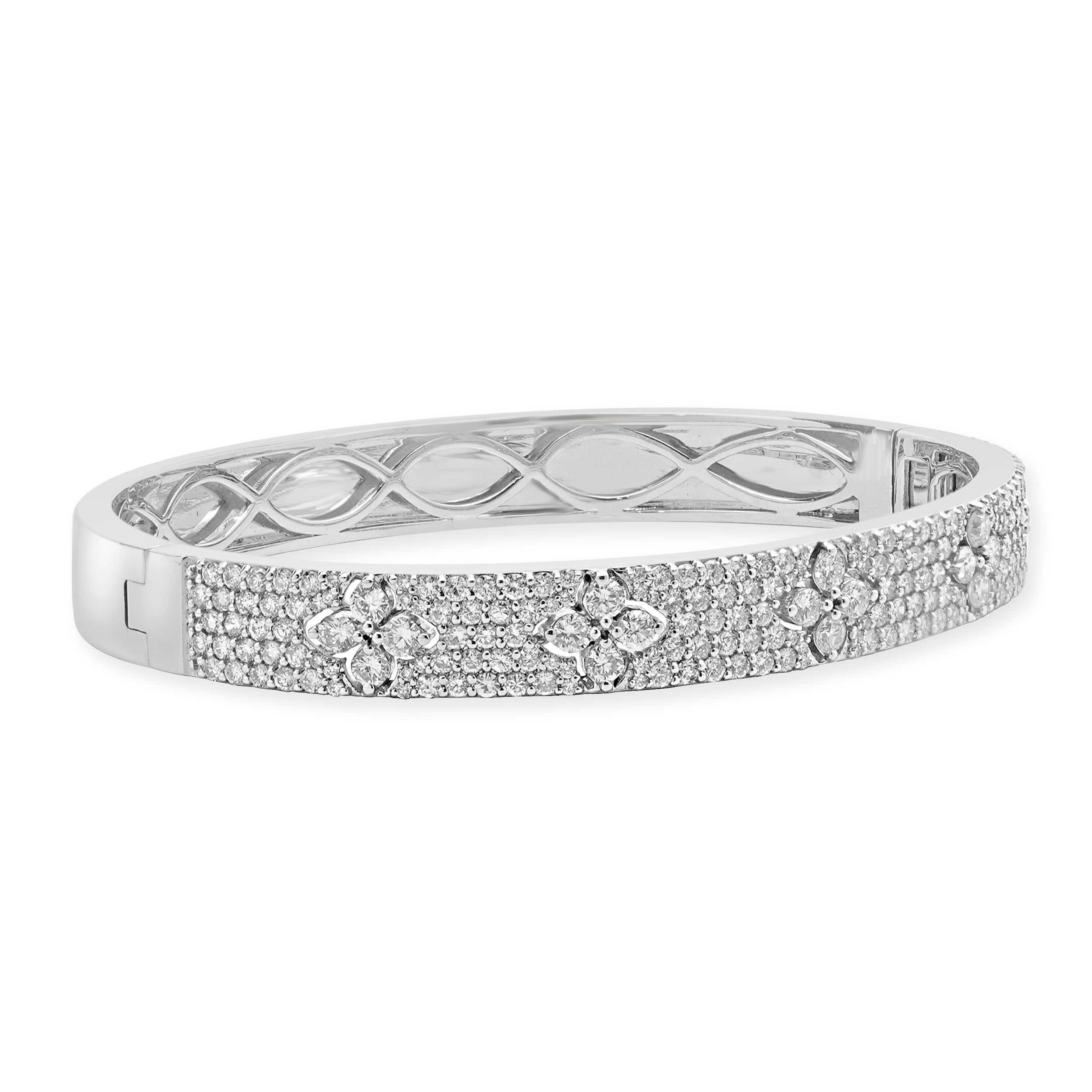Material: 18K white gold
Diamonds: 218 round brilliant cut = 3.25cttw
Color: G  /H
Clarity: SI1-2
Dimensions: bracelet will fit up to a 7-inch wrist 
Weight: 25.15 grams