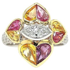 Anello bicolore 18 Kt, diamanti da 0,85 carati, rubini taglio cuore e zaffiro da 2,47 carati