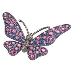 18 Karat Blackened Gold Butterfly Brooch with Diamonds, Pink and Blue Sapphires