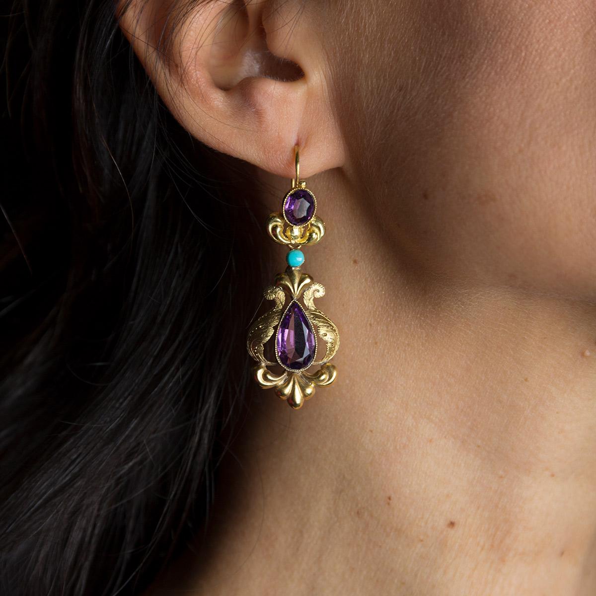 Early 1900s 18 kt yellow gold antique earrings with amethysts and turquoise from Sicily.
This jewel is a unique opportunity to relive an emotion of the past in the wake of timeless elegance. 
Behind every antique jewel symbol of charm and
