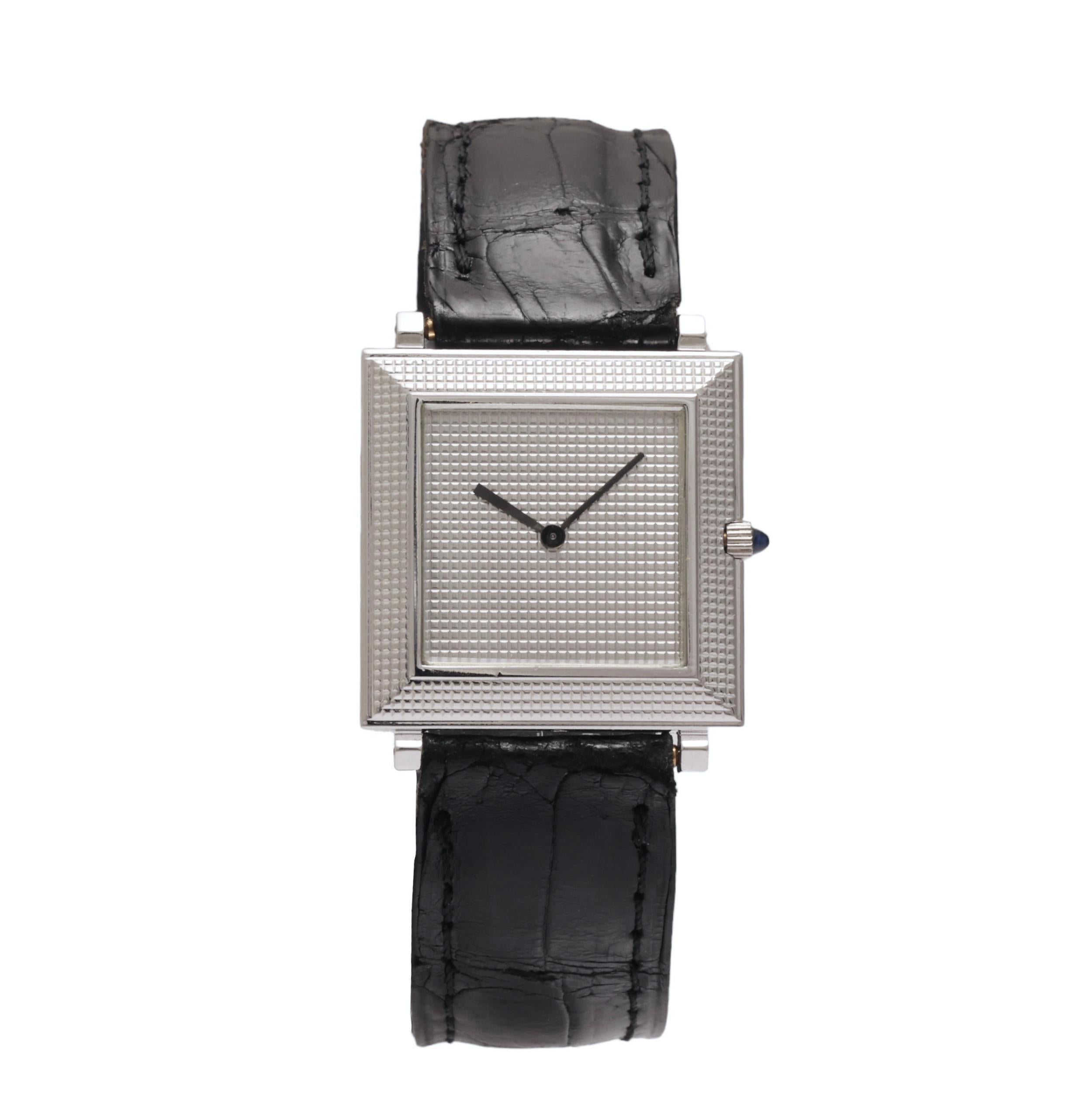 Boucheron Vintage Wristwatch, Extra-Flat Square in 18 kt. White Gold with Textured Dial and Bezel

Movement: mechanical winding

Case: 18 kt. white gold case, measurements 25.5 mm x 25.5 mm x 3.5 mm With Stepped hobnail texture, Clous De Paris