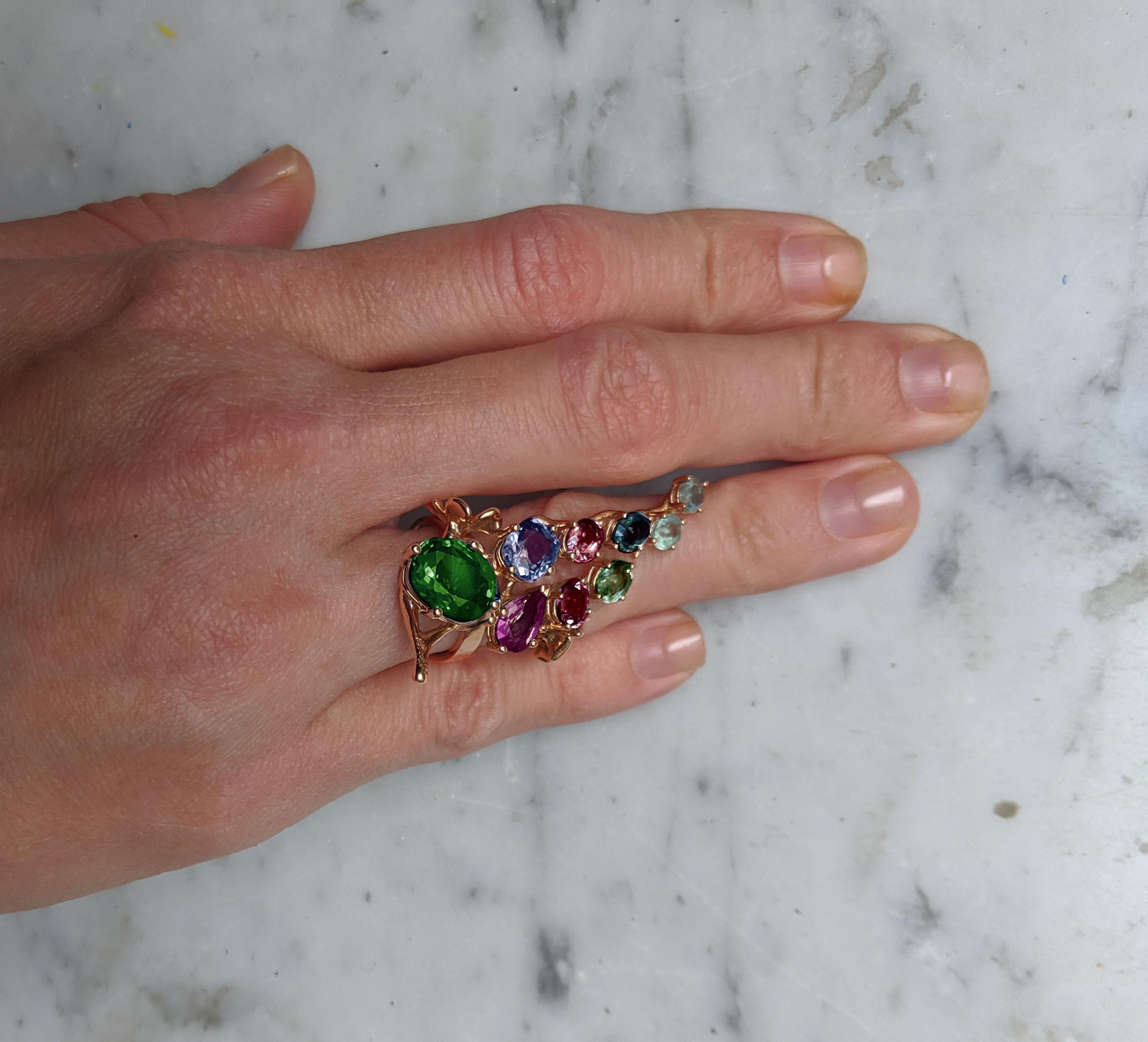 The heart of this 18 karat yellow gold Tobacco Flower engagement cluster ring is unheated untreated natural oval vivid minty tsavorite, GIA certified, 4,64 carats, 12,5x9,75x5,26 mm. This piece can be personally signed for the same price.

There is
