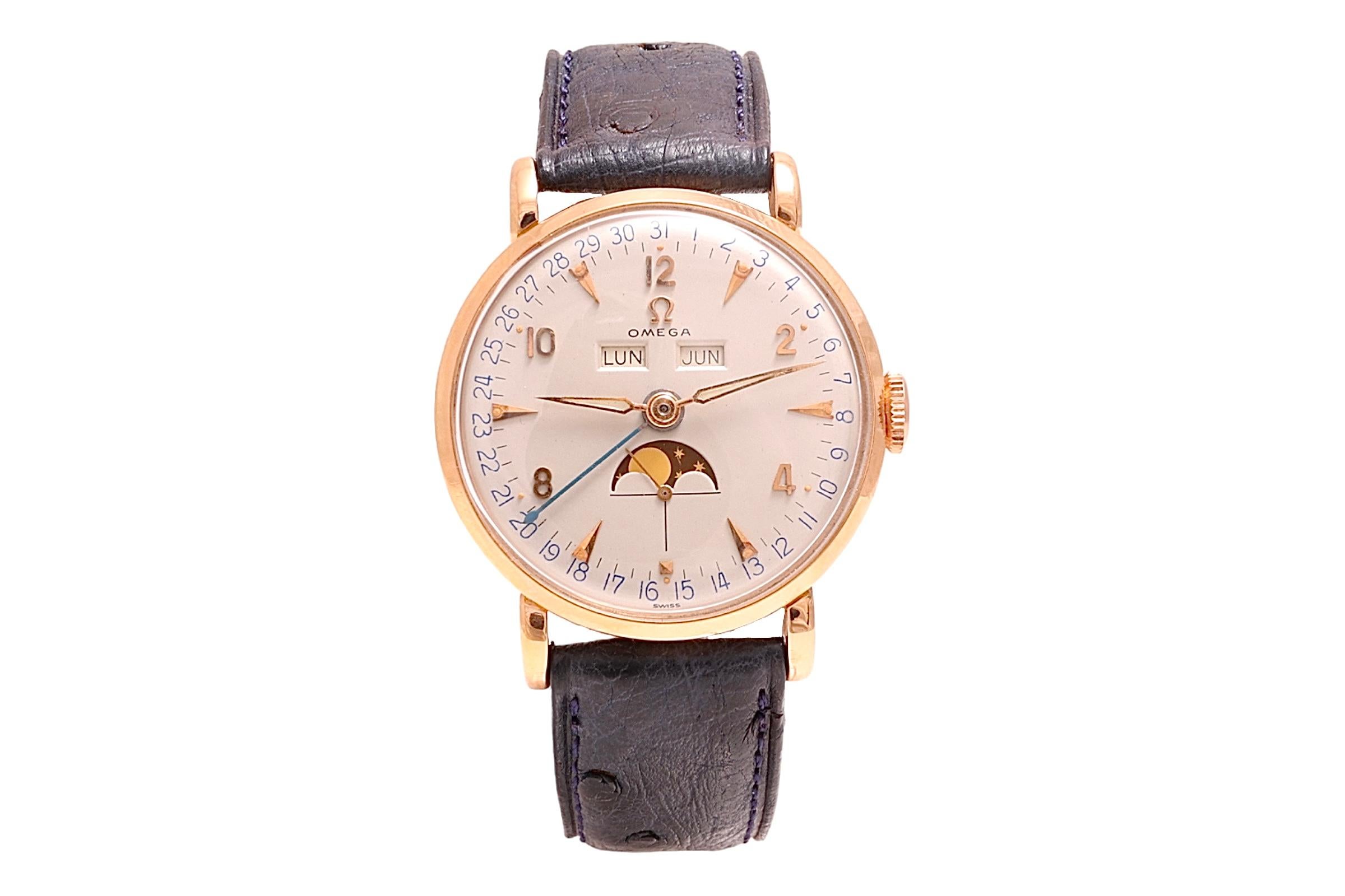 18 Kt Pink/ Rose Gold  Omega Cosmic Triple Date Moon Phase Collectors Wrist Watch Ref OT2473 with Omega Extract from the Archives.

Extremely rare and unseen collectors condition !

Movement : Mechanical Manual Winding , Caliber 381

Functions : Sub