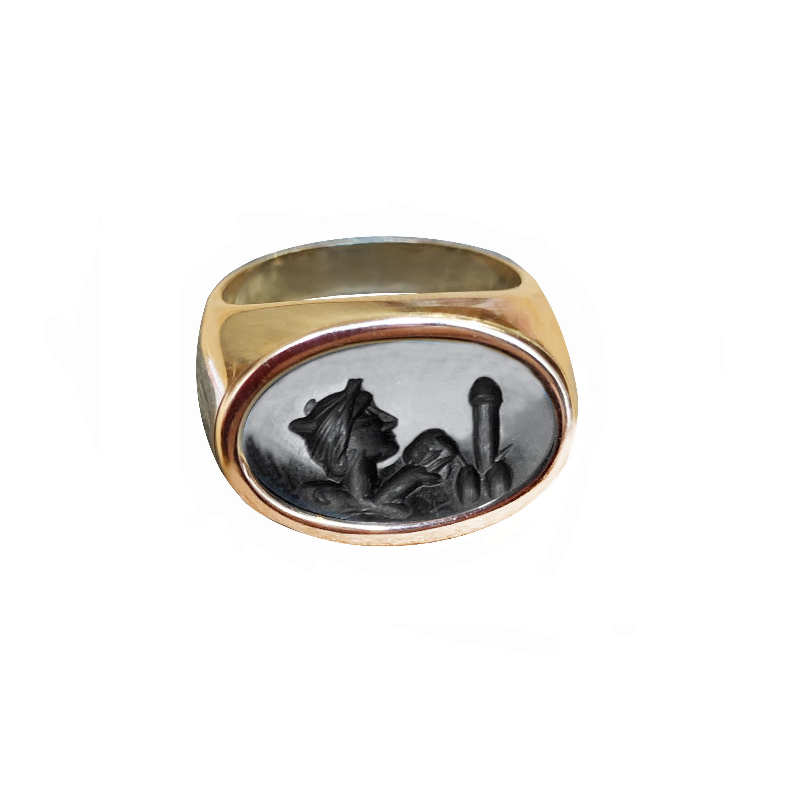 In this 18 kt gold ring is set an authentic Roman intaglio on onyx ( circa 1st cent.AD ) , which depicts the god Dionysus with a 
