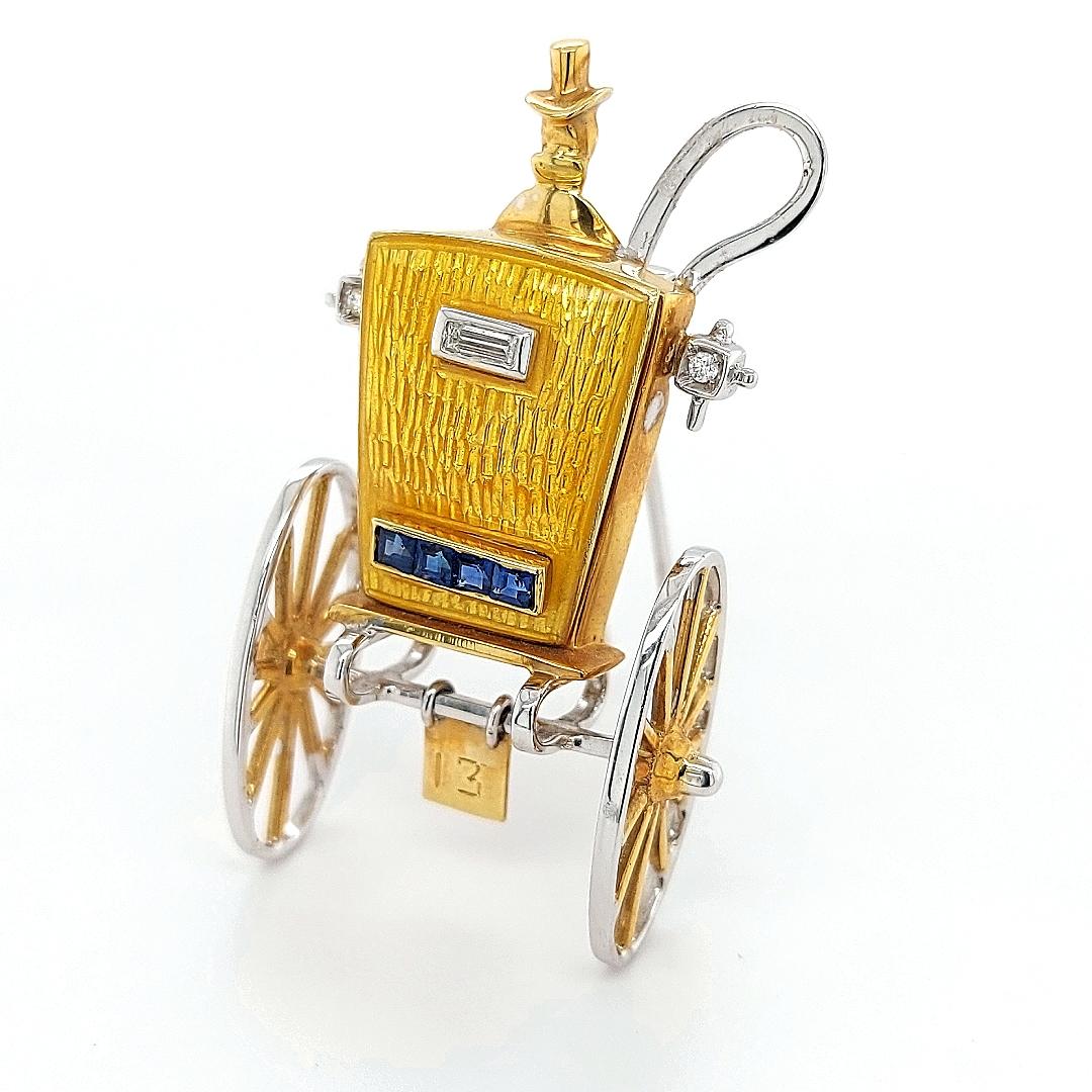 This charming old fashioned carriage brooch features the rear side of a horse-drawn carriage and driver, crafted of 18 karat yellow gold . Finished with a pin clasp. Can also be used as a pendant.

Diamonds: 0,14ct

Sapphire: 0,25ct

Material: 18kt