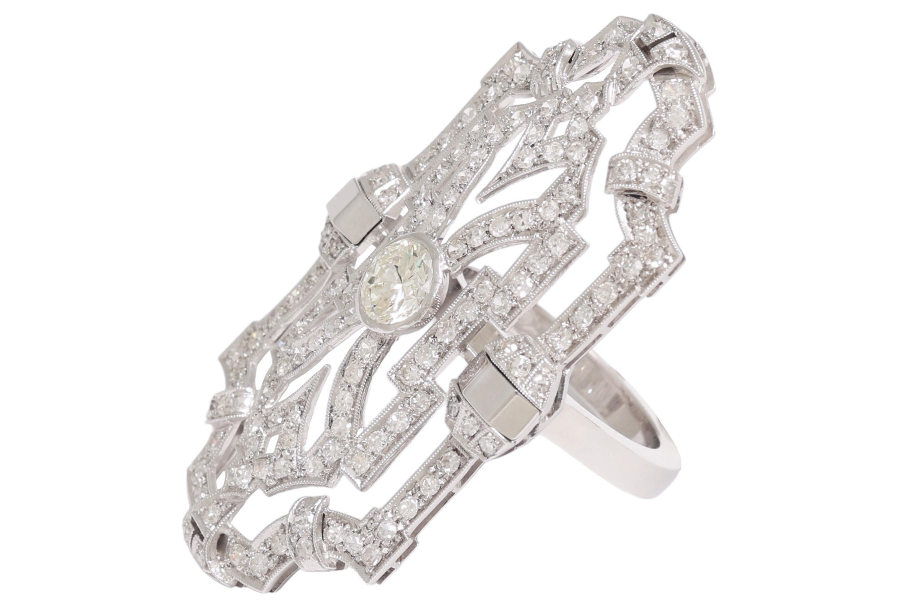 Art déco 18 kt. Bague en or avec 1,2 ct. Diamant central entouré de 4,65 ct. Diamants en vente