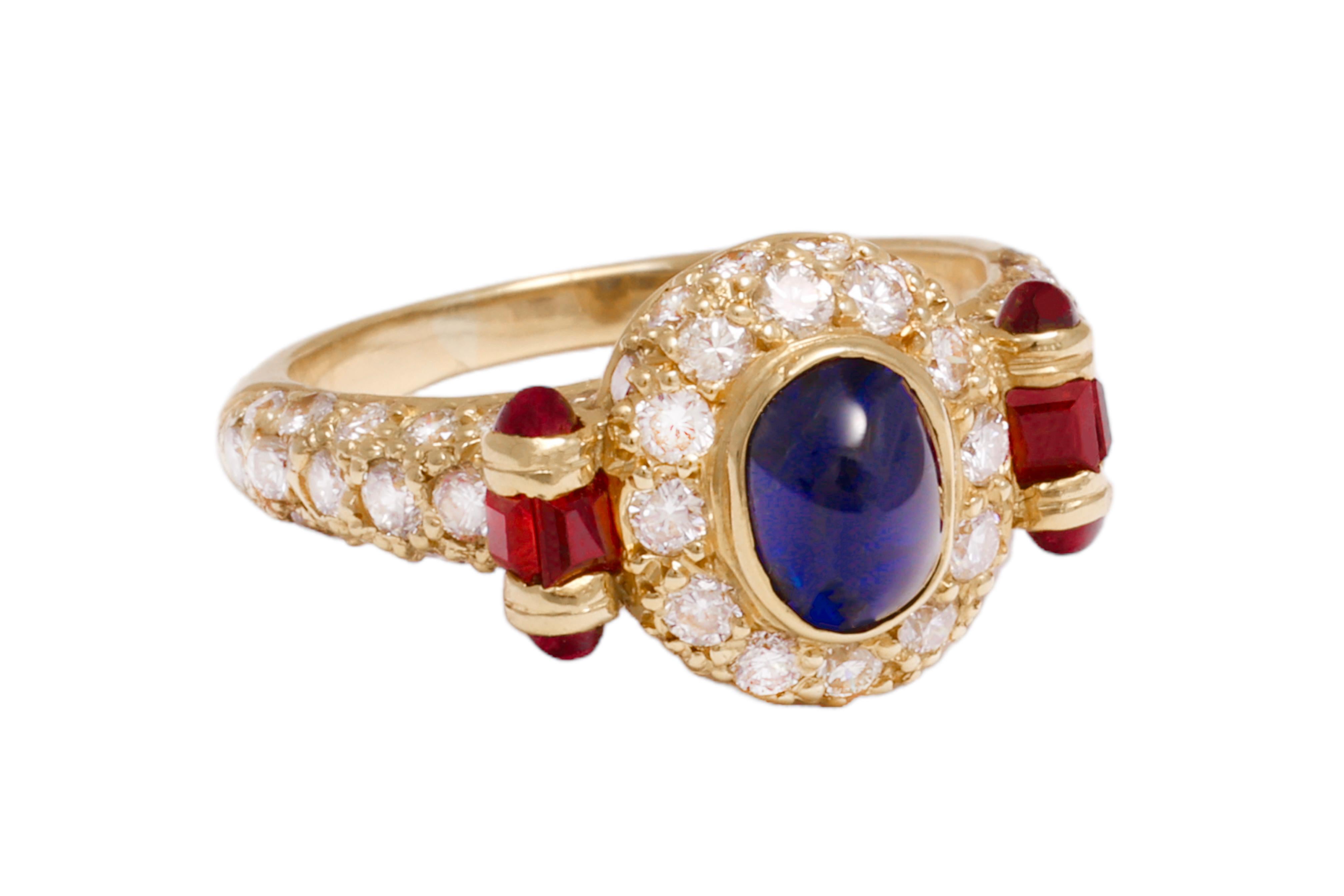 Magnificant 18 kt. Gold Ring With Cabochon Sapphire and Ruby  and Diamond

Diamonds: Brilliant cut diamonds together 1.16 ct.

Sapphire: Cabochon sapphire 1.20 ct.

Ruby: 4 mini ruby cabochon, 4 mini square cut ruby

Material: 18 kt yellow