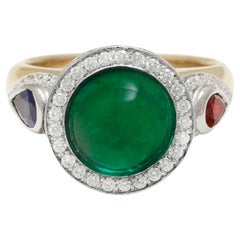 18 kt. Gold Ring With 3.78 ct. Minor Emerald Cabochon, Diamonds, Sapphire, Ruby