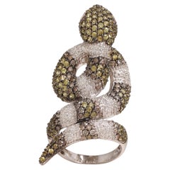 18 Kt Gold Snake Ring With 4 Carat White Diamonds 
Color Stone,  Emerald.