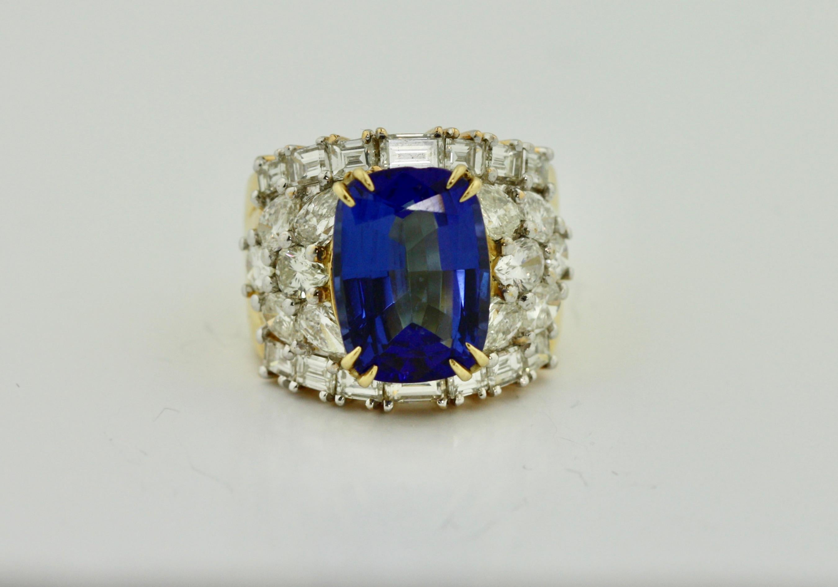 
18 kt Gold, Tanzanite and Diamond Ring 
Tanzanite weighing approximately 7.58 cts 
Diamonds weighing approximately 4.15 cts 
9.8 DWT (gross), size 4 