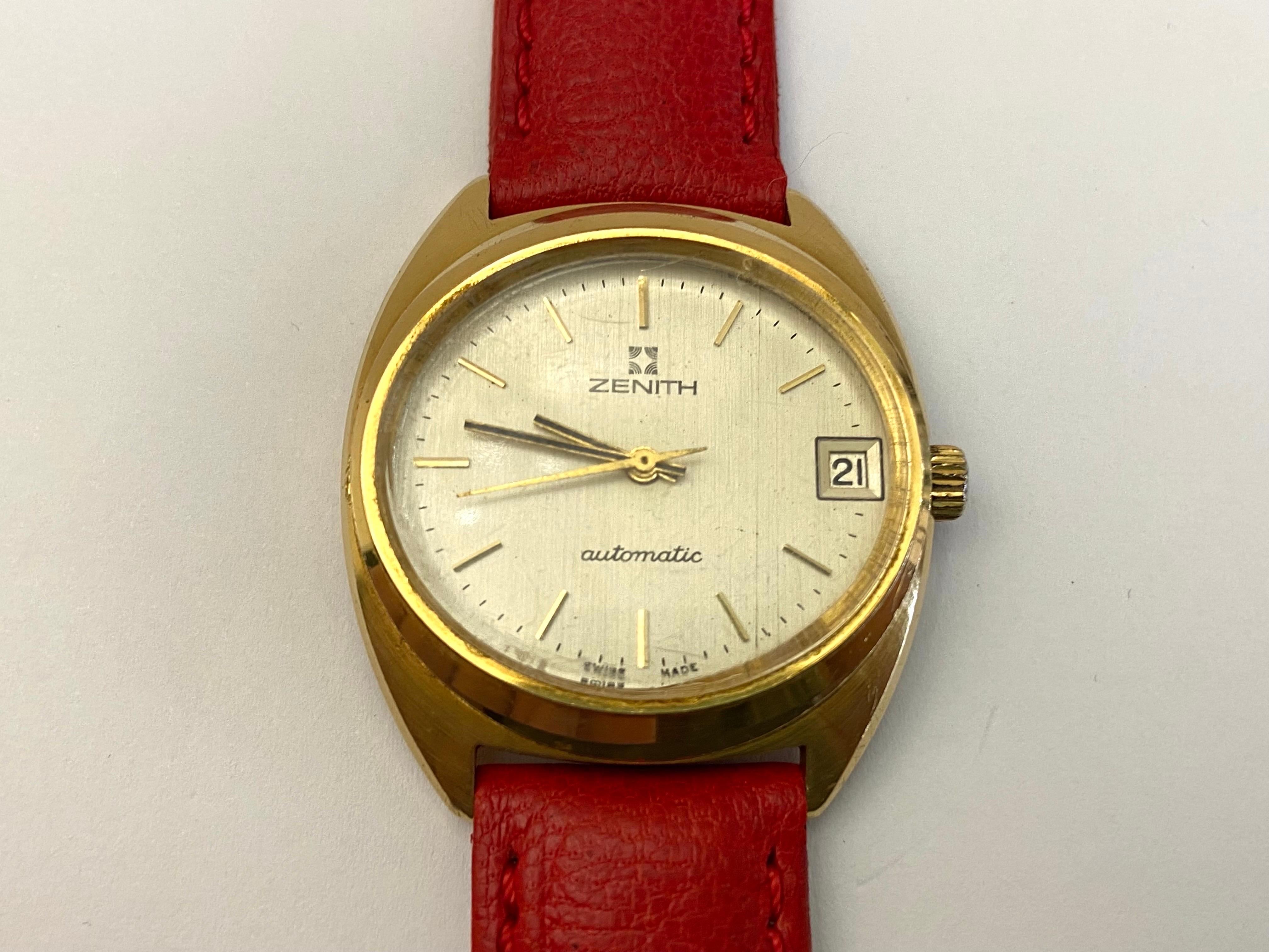 18 Kt Gold ZENITH Automatic Watch,Vintage,1970s.
Solid Gold case, 34 mm, champagne colored dial, original crown, mechanical (Automatic).Leather strap replaced leaving the original buckle. Gross weight is 40 grams. Shipping in a elegant case with led