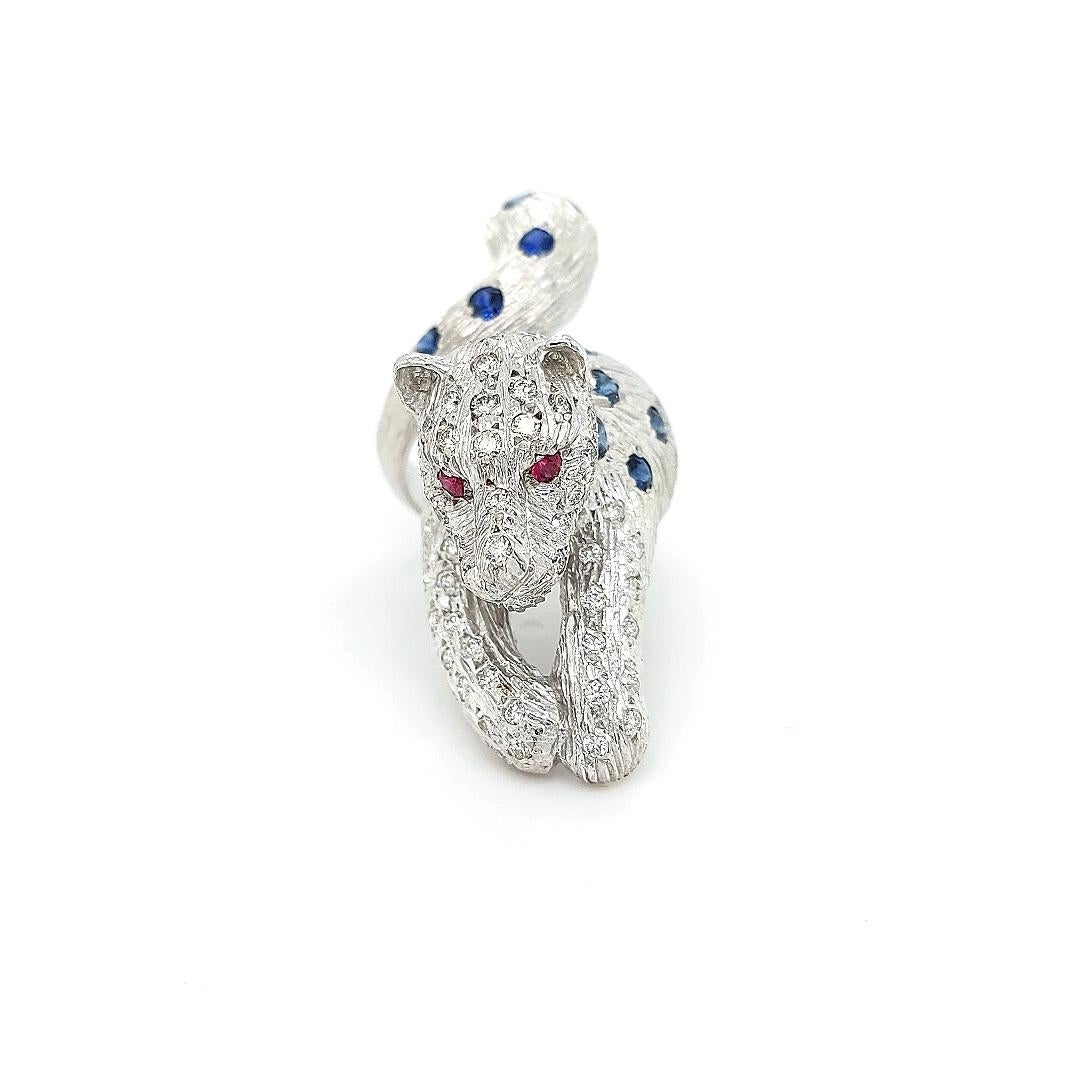 18kt Maramenos Pateras Panther / Tiger Ring with diamonds and sapphires

Amazing solid 18 kt white gold ring.
A real eye catcher which wears very smoothly with everything.

Size : EU 58 / US 8 1/2 Size can be adjusted for free. 

Stones : Diamonds