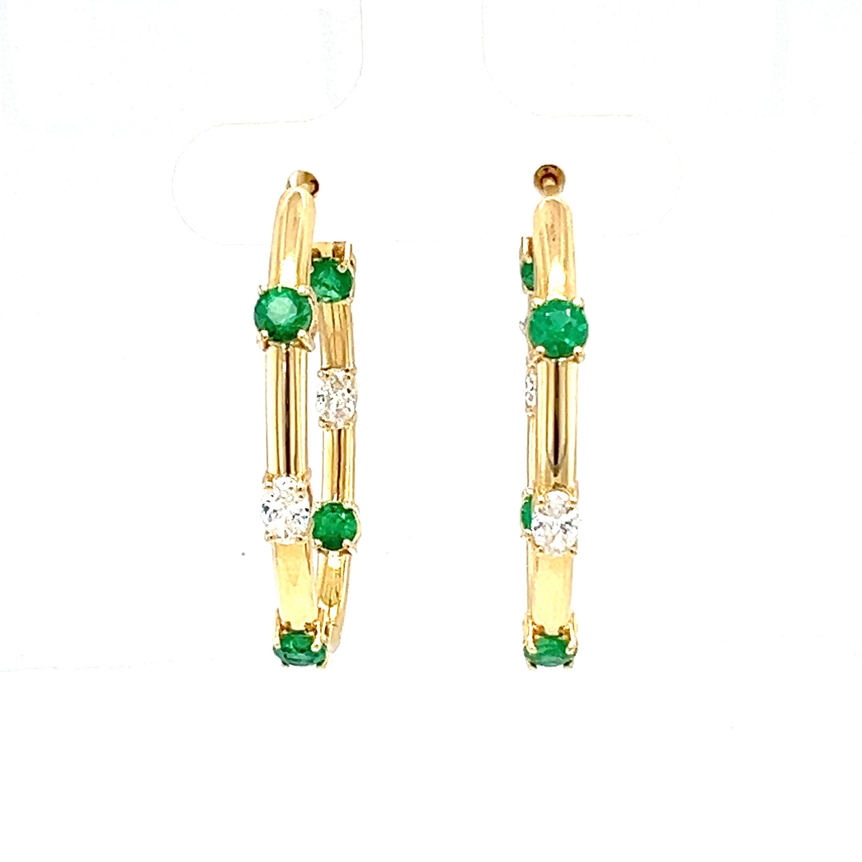 These stunning pair of 18-karat yellow gold hoop earrings set with 1.65-carat oval-shaped emeralds and 0.80-carat oval-shaped diamonds are made of natural emerald and diamond. 