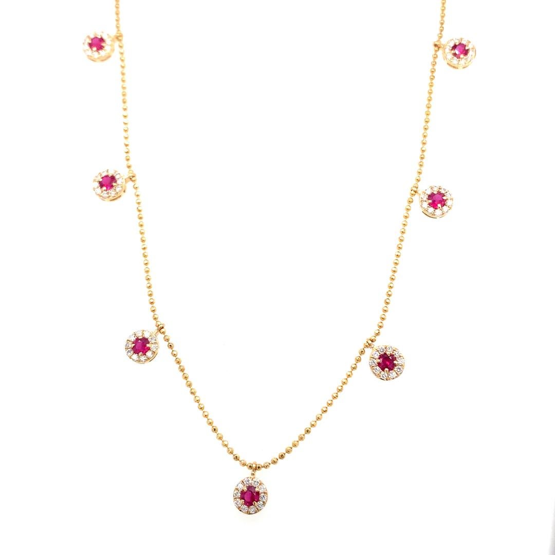 Natural 0.37-carat diamond and 0.57-carat ruby drop necklace set in 18-karat yellow gold with an adjustable necklace chain setting. 