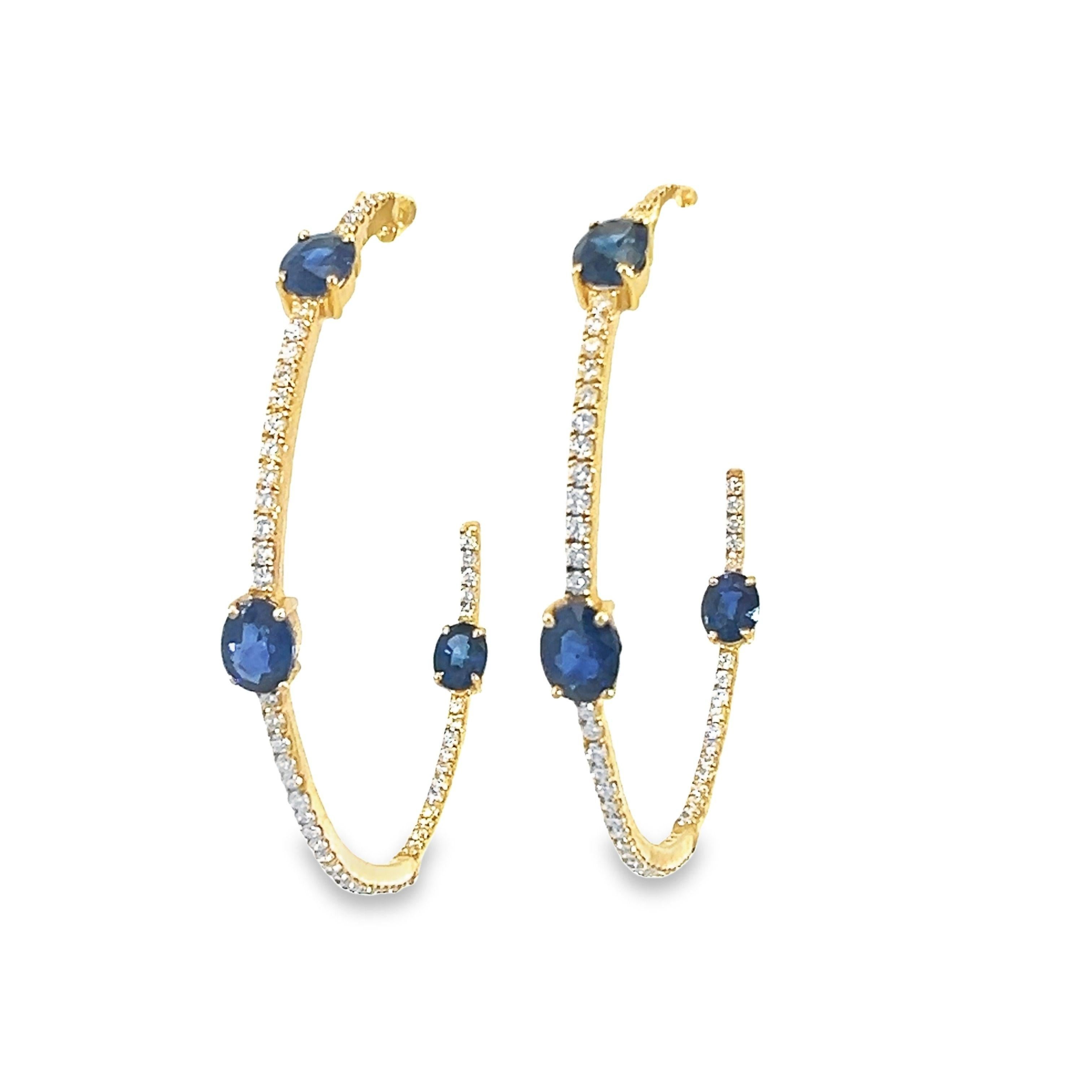 A stunning pair of 18-karat yellow gold hoops earrings with a 2.74-carat natural blue sapphire and 0.81-carat diamonds. 
An element of elegance added to any ensemble with these earrings, featuring deep blue sapphires set in an effective design with