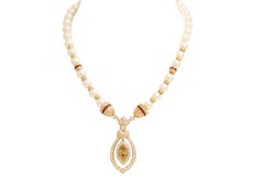 Collier 18 carats et perles, diamants, rubis, diamant central marquise cognac