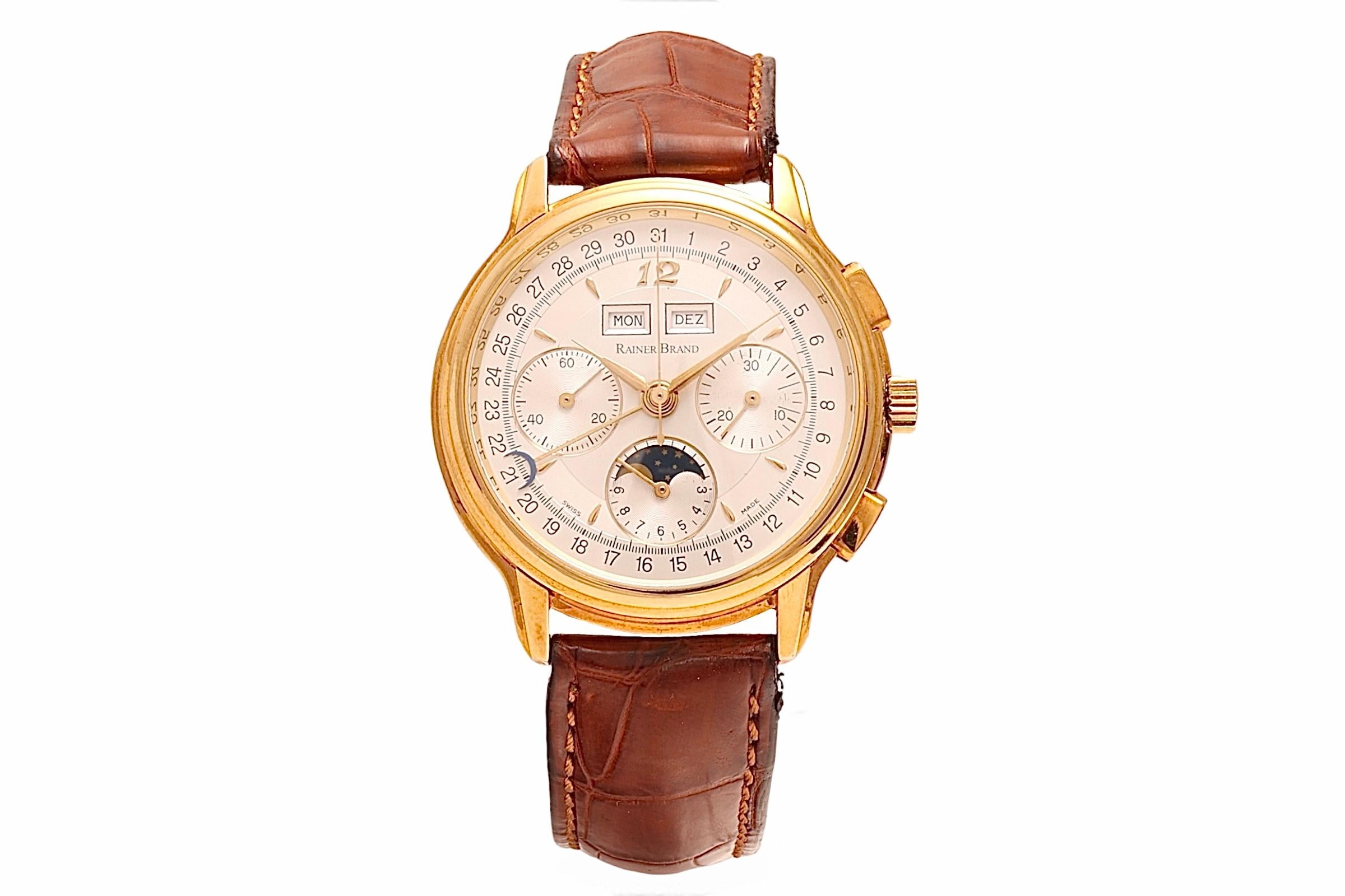 18 Kt Rainer Brand Triple Date Moonphase Chronograph Wrist Watch, Brand New In Box With all Warranty Papers, Rare Collectors Watch

Case : 18 Kt Solid Gold, Diameter 39.5 mm

Strap : To fit wrist of Max length 20 cm

“Let us render time a worthy