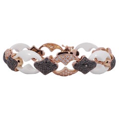 18 kt. Set aus Armband aus Roségold und Keramik mit 6,36 Karat. Schwarze und weiße Diamanten