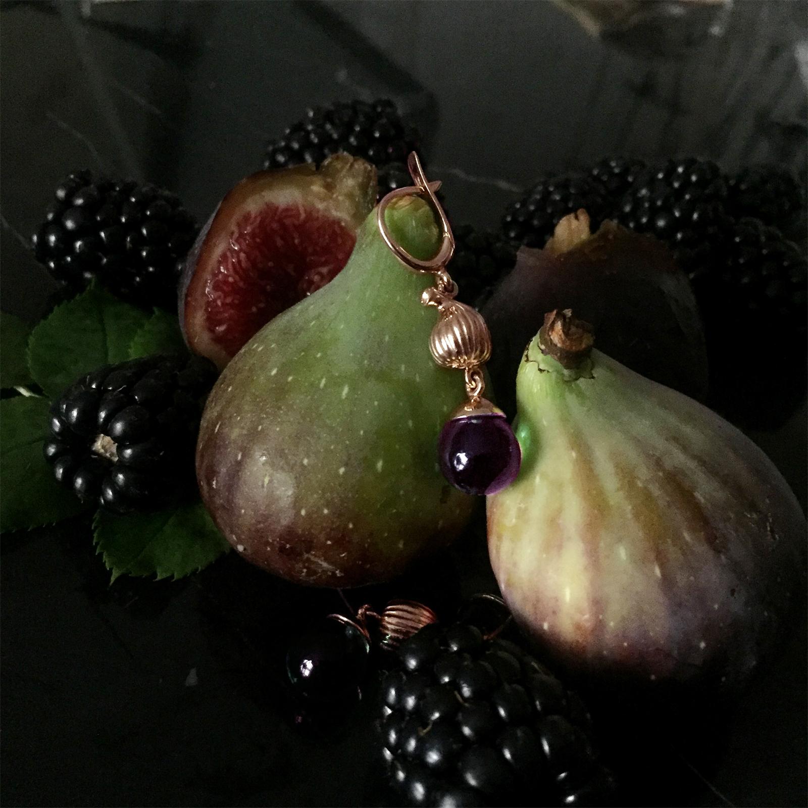 These Fig Fruits cocktail earrings are made of 18 karat rose gold and feature detachable cabochon amethyst drops that allow light to pass through and two black diamonds. They were designed by the artist Polya Medvedeva and were featured in a Vogue