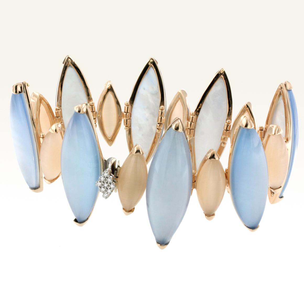 Modern Bracelet in 18K rose Gold with Double stones (mother of pearl and blue topaz) cabochon marquise cut (size: 12 X 35 mm), moonstone cabochon marquise cut (size: 8 X 18 mm) and white  Diamond karat 0.09 VS colour G/H. 
Designed and handmade in