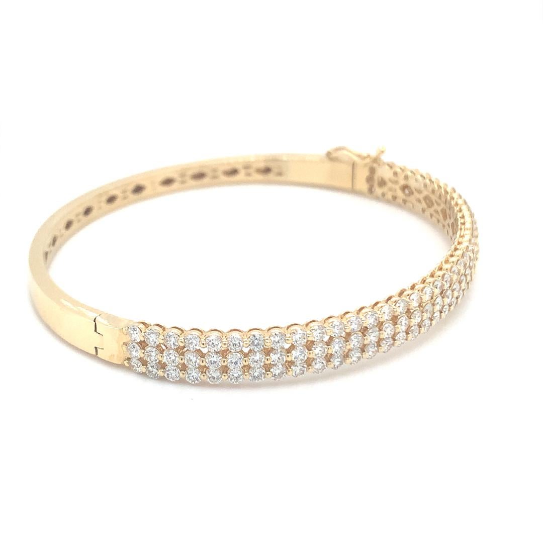 Natural 3.45 Carat VS quality diamond solid bangle set in 18 Kt yellow gold. 