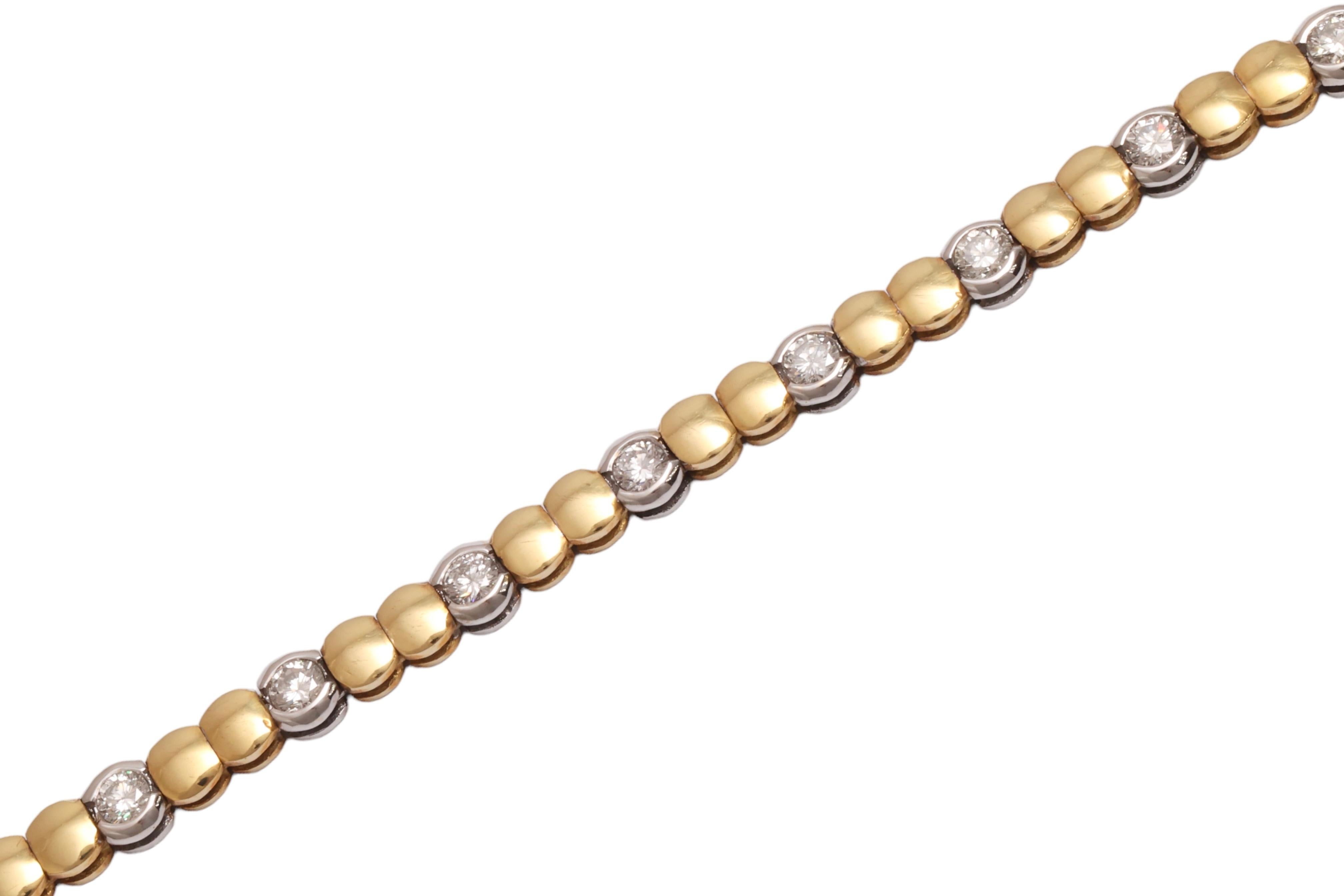 18 KT. SOLID WHITE & YELLOW GOLD TENNIS BRACELET, SET WITH 2 CTS BRILJANT CUT DIAMONDS.

WEIGHT :17.5 GRAMS

LENGHT : 19.5 CM

DIAMONDS: brillliant cut diamonds, together 2 cts, Top Clarity & Color
