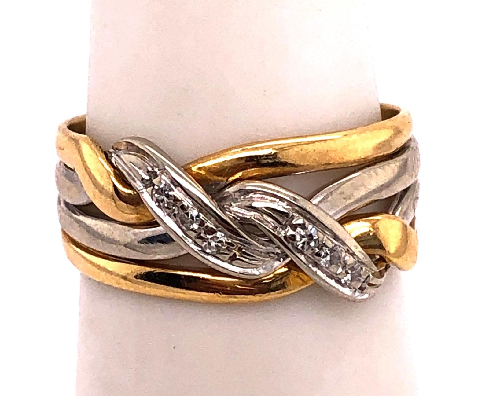 18 Karat Two Tone Gold Twist Ring with Round Diamonds 0.18 Total Diamond Weight.
Size 4.5 
4 grams total weight.