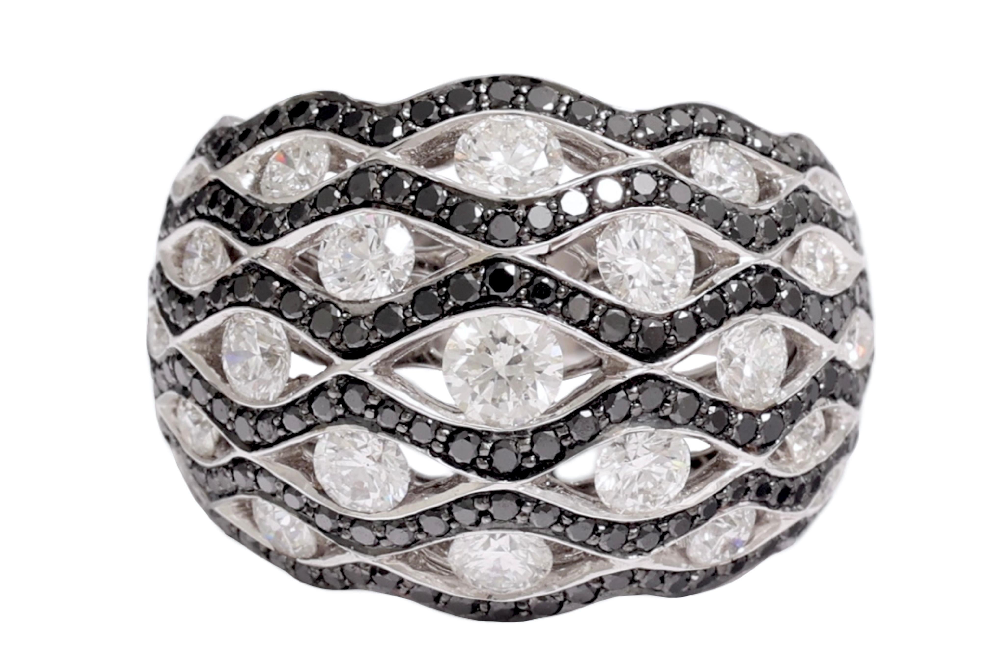 ORIGINAL RING WITH BLACK AND WHITE DIAMONDS

MATERIAL: 18 kt white gold

SIZE: 55 ( can be resized for free)

WEIGHT: 13 grams / 0.455 oz / 8.30 dwt

DIAMONDS: white brilliant cut diamonds (together ca. 1.98 Cts fF VS ), black diamonds (together 