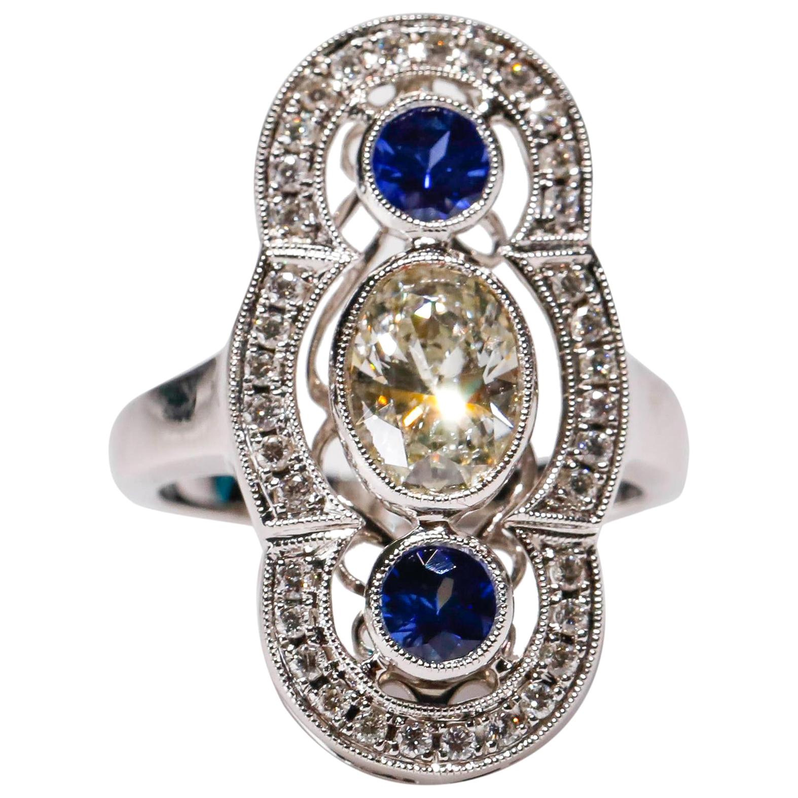 18 kt White Gold 0.52 Ct Blue Sapphire 1.30 Ct Oval White Diamond Long Ring

Crafted in 18 kt White Gold, this Unique design showcases a Blue Sapphire 0.93 TCW Oval shaped Sapphire, set in a halo of round-cut mesmerizing diamonds, Polished to a