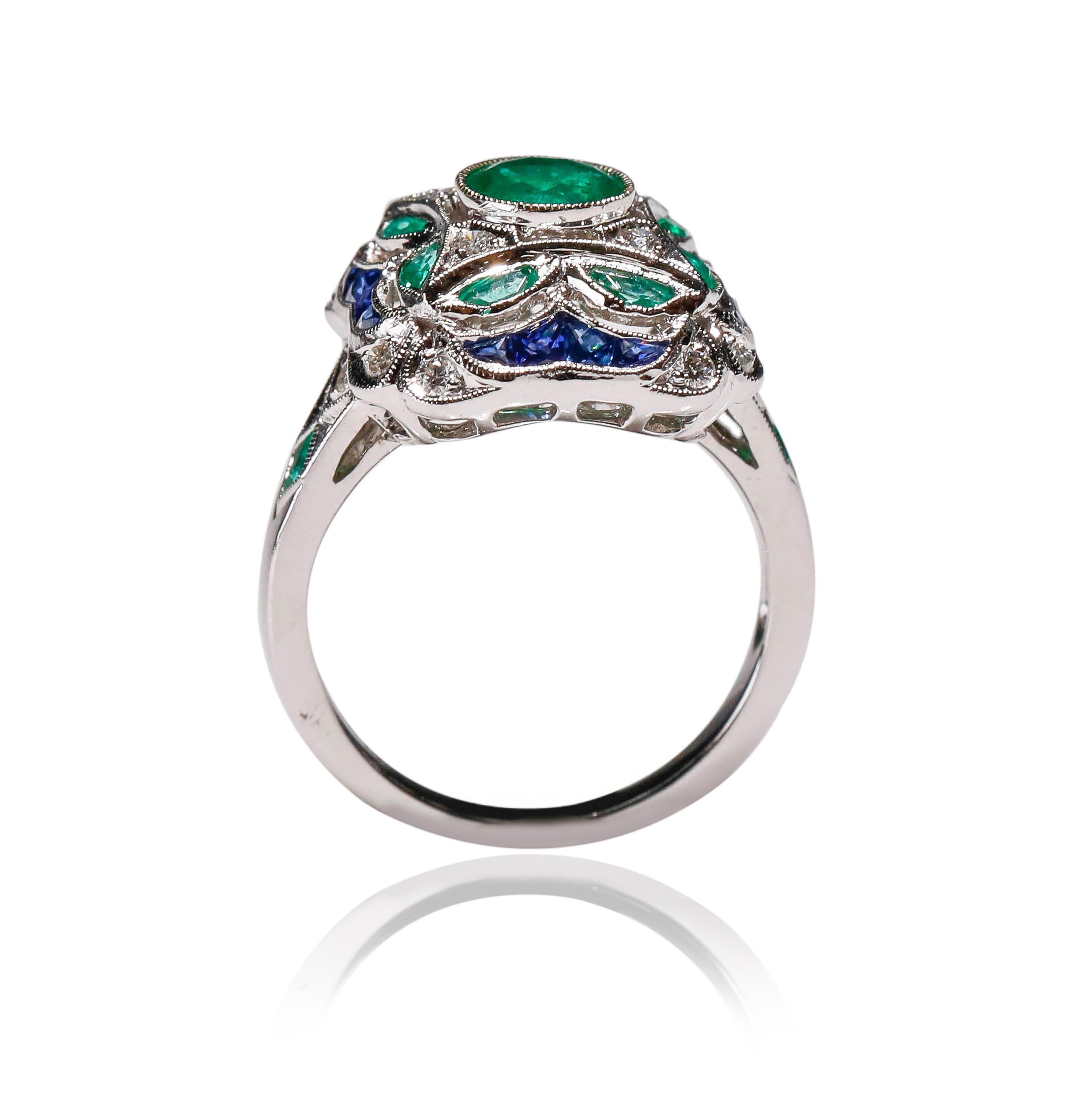 18 Kt White Gold 1.17 Ct Diamond 1 Carat Sapphire 1.1 ct Emerald Cocktail Ring

Crafted in 18 kt White Gold, this Unique design showcases an Emerald 1.21 TCW multi-shaped with diamond and blue sapphire, set in a Cocktail Ring with mesmerizing
