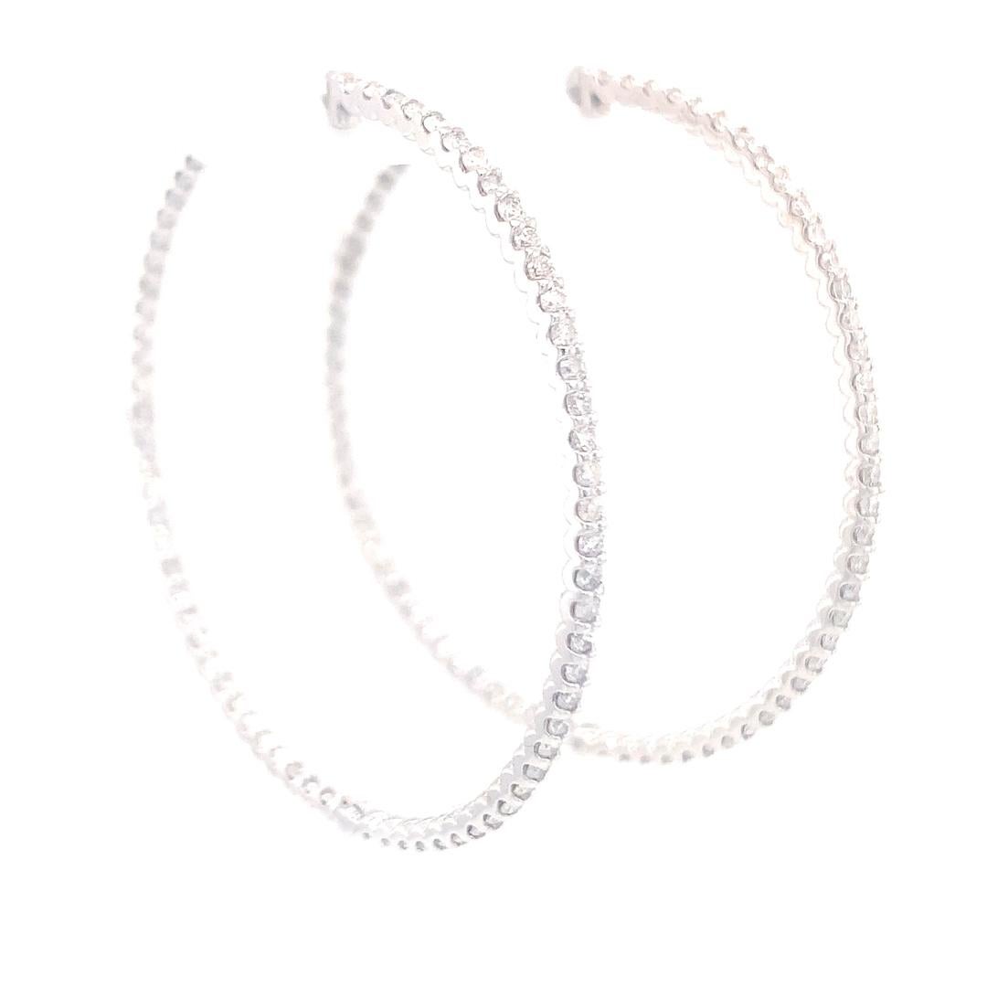 A beautiful pair of natural 1.20 carat diamond Hoop earrings are set in 18-kt white gold. 

Diamonds are set inside and outside the hoop for amazing sparkle and great look. 
