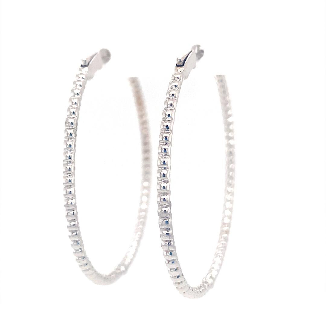 Women's 18-Kt white gold 1.20 carat diamond hoop earrings For Sale